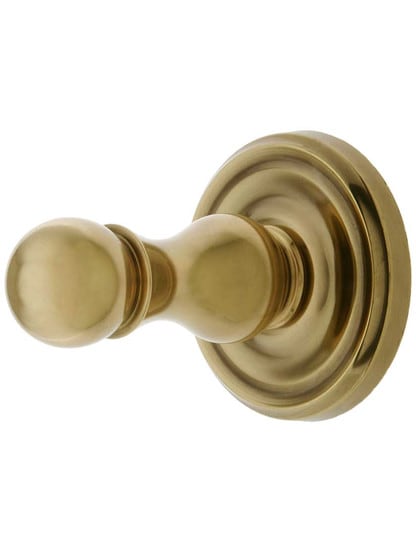 Solid Brass Single Hook Post with Classic Rosette in Antique Brass.